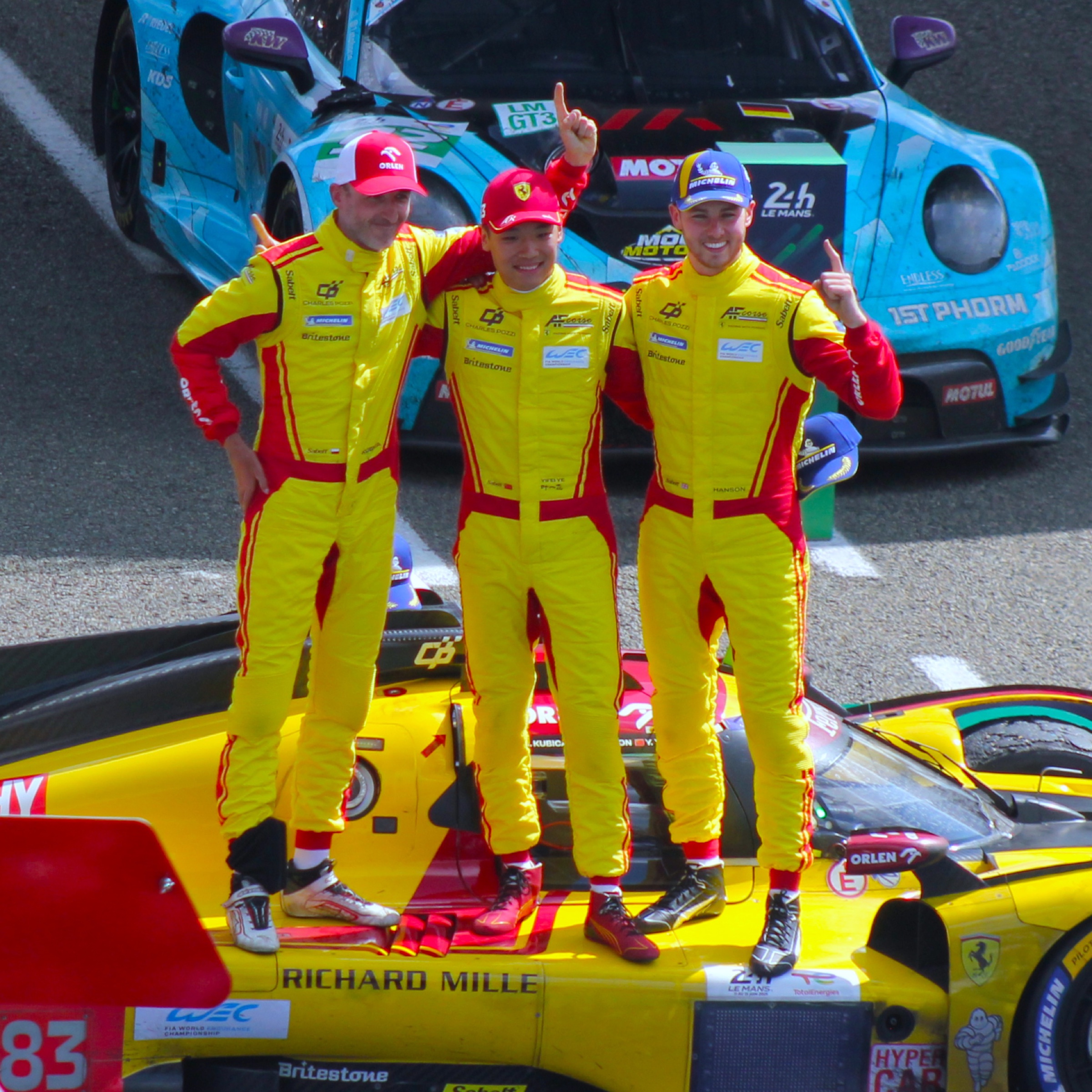 Yifei Ye, centre, with the winning No. 83 Ferrari driver crew at Le Mans.
